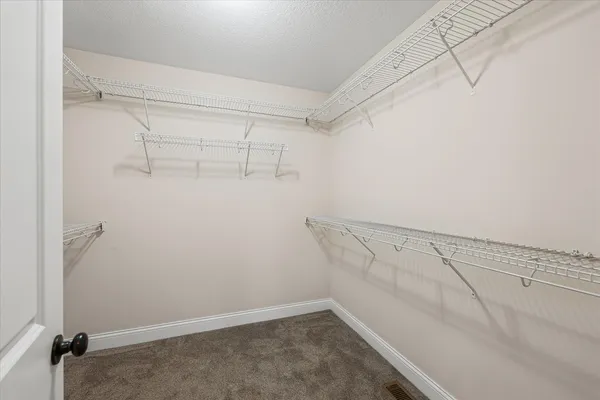 a view of a room with racks on the wall