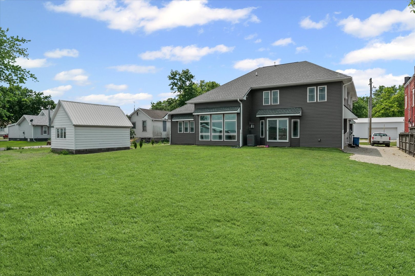 103 1st Street Strawn, IL 61775 - Photo 43 of 50 a front view of a house with a garden and yard