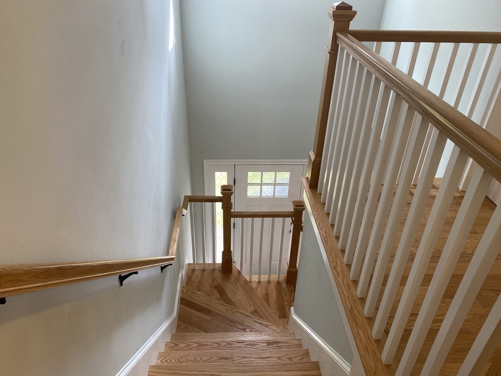 7 Marshall Street, Unit 7 Ayer, MA 01432 - Photo 11 of 31 a view of a hallway with staircase