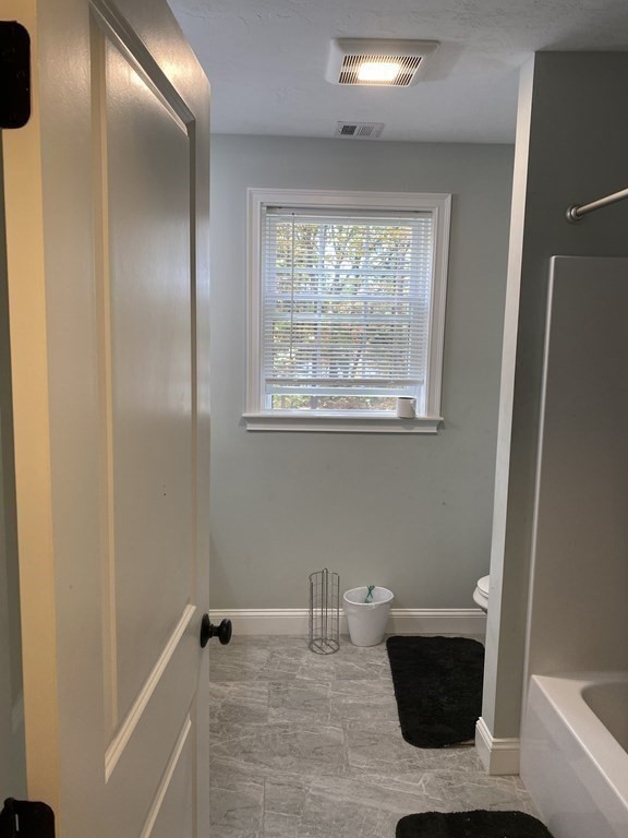 7 Marshall Street, Unit 7 Ayer, MA 01432 - Photo 15 of 31 a bathroom with a sink and a mirror