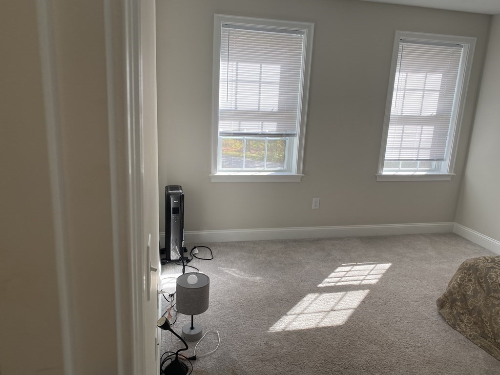 7 Marshall Street, Unit 7 Ayer, MA 01432 - Photo 16 of 31 a room with a window and gym equipment