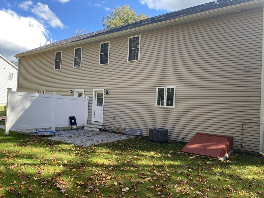7 Marshall Street, Unit 7 Ayer, MA 01432 - Photo 22 of 31 a view of a house with a yard