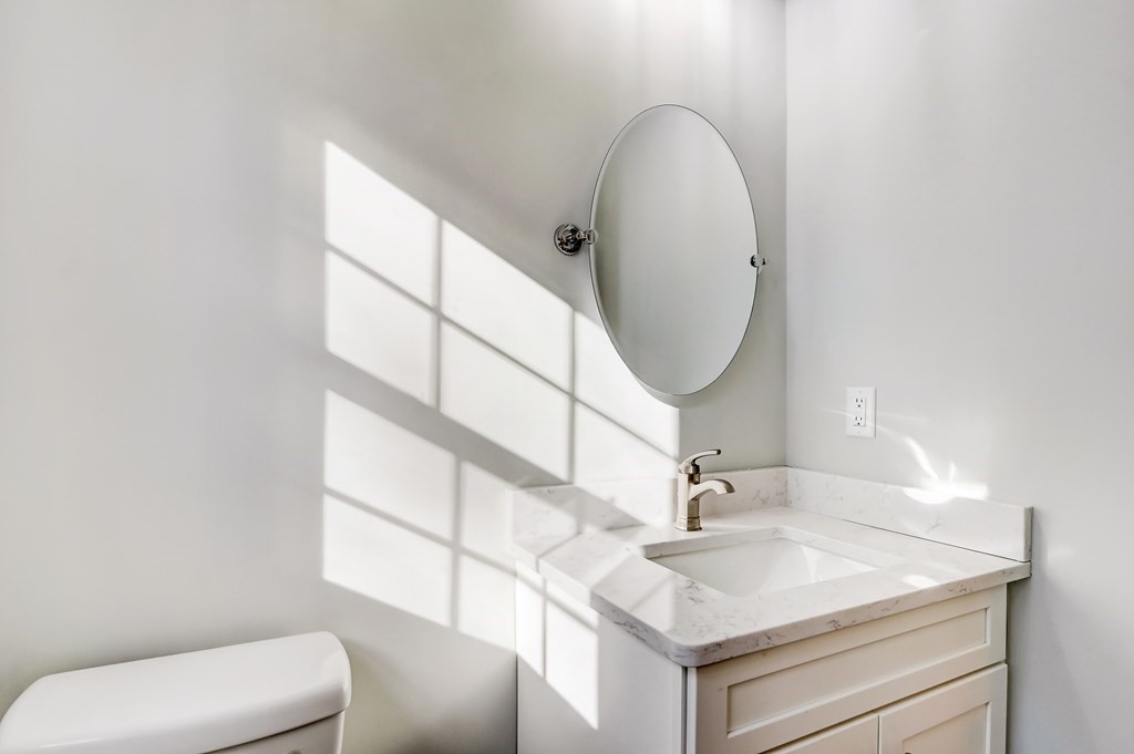 7 Marshall Street, Unit 7 Ayer, MA 01432 - Photo 29 of 31 a bathroom with a sink and a mirror