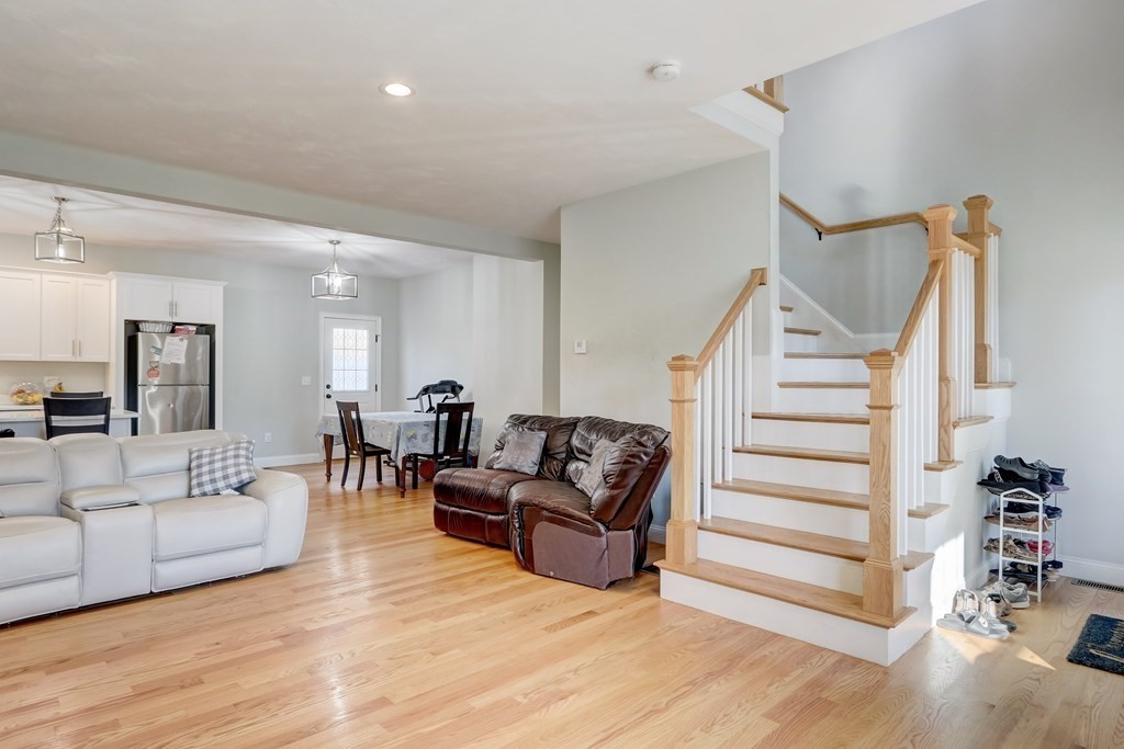 7 Marshall Street, Unit 7 Ayer, MA 01432 - Photo 3 of 31 a living room with furniture and wooden floor