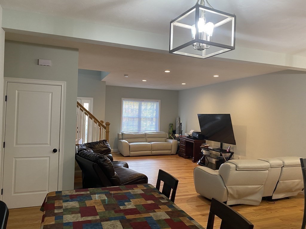 7 Marshall Street, Unit 7 Ayer, MA 01432 - Photo 7 of 31 a living room with furniture and a flat screen tv