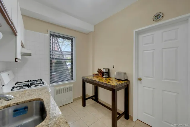 a view of workspace with furniture and window