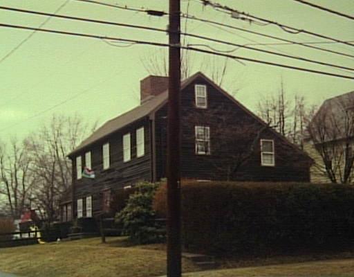 a view of a house with a street