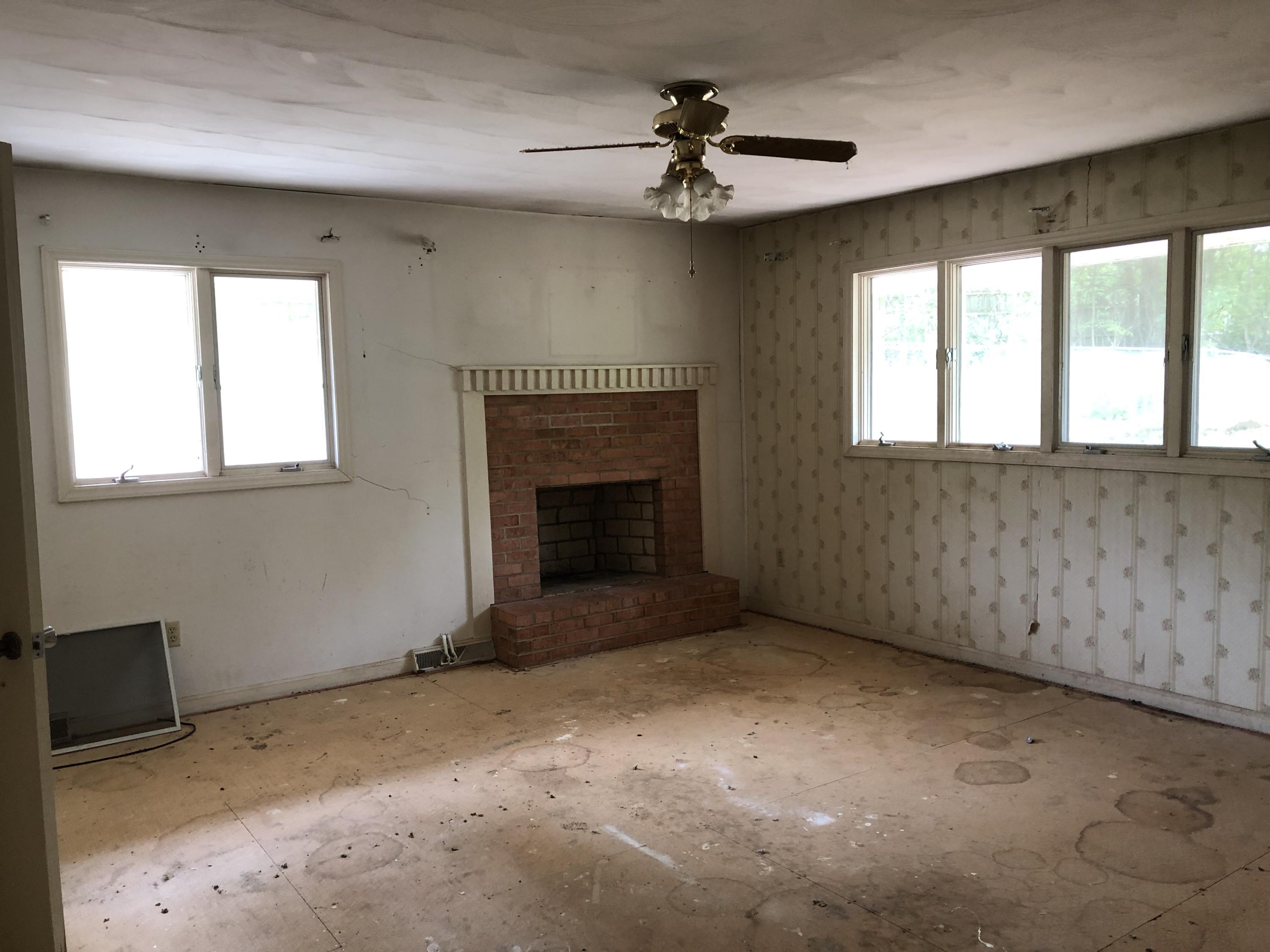 1764 Blue Ridge Springs Road Blue Ridge, VA 24064 - Photo 13 of 19 a view of an empty room with a fireplace and a window