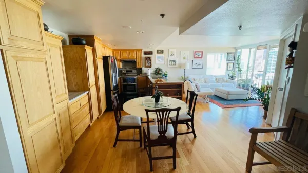 a view of a dining room with furniture and wooden floor
