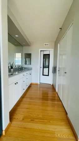 a view of kitchen and empty room
