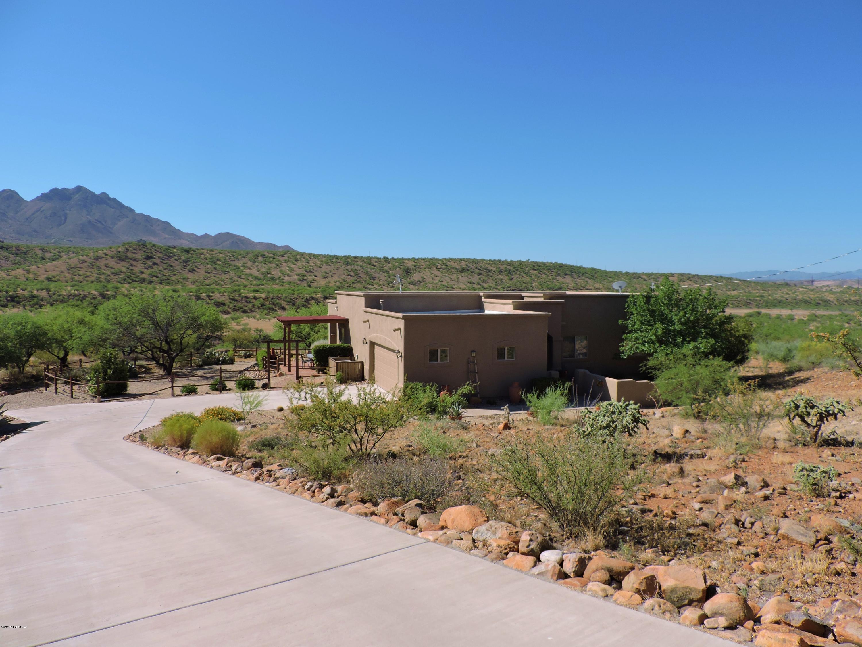 1786 Zimmer Court Rio Rico, AZ 85648 - Photo 4 of 42 a view of a house with a garden