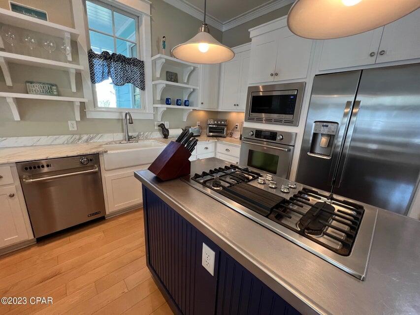 114 Parkshore Drive Panama City Beach, FL 32413 - Photo 11 of 86 a kitchen with a stove and a refrigerator