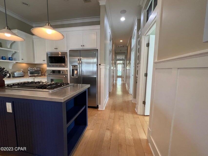114 Parkshore Drive Panama City Beach, FL 32413 - Photo 14 of 86 a kitchen with stainless steel appliances granite countertop a sink and a refrigerator