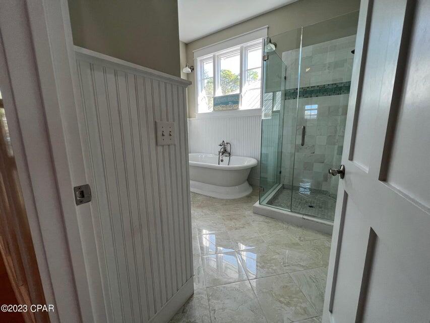 114 Parkshore Drive Panama City Beach, FL 32413 - Photo 15 of 86 a bathroom with a granite countertop shower a toilet and a sink