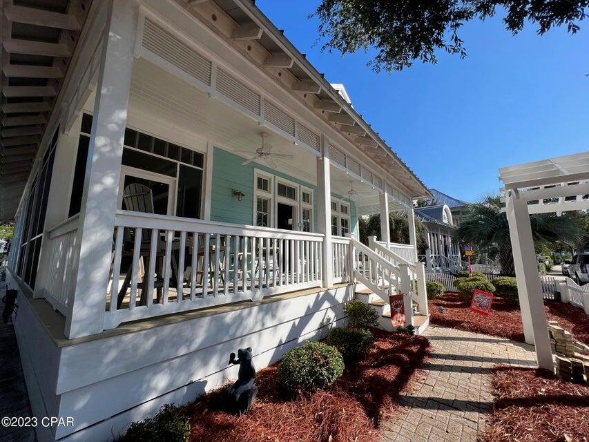 114 Parkshore Drive Panama City Beach, FL 32413 - Photo 2 of 86 a front view of a house with a garden