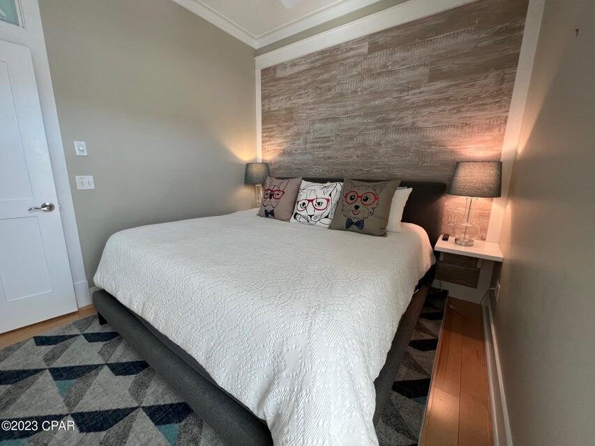 114 Parkshore Drive Panama City Beach, FL 32413 - Photo 22 of 86 a bed sitting in a bedroom next to a window