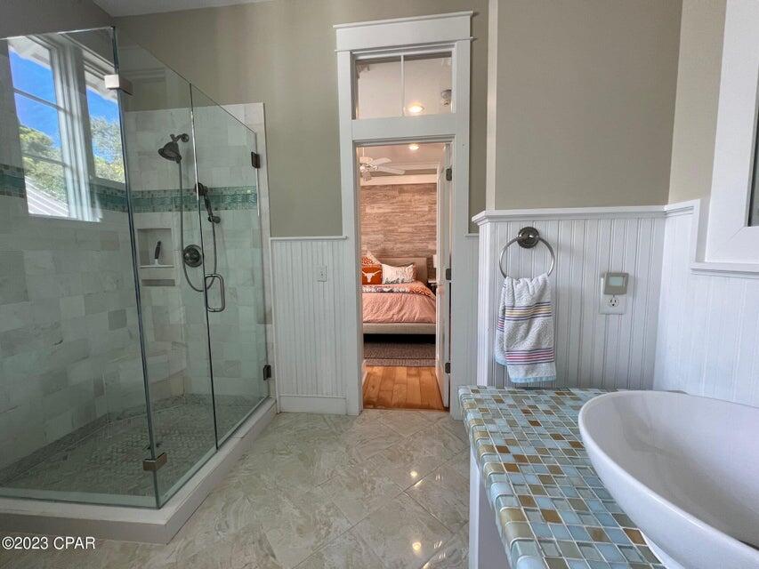 114 Parkshore Drive Panama City Beach, FL 32413 - Photo 27 of 86 a bathroom with a tub shower and sink