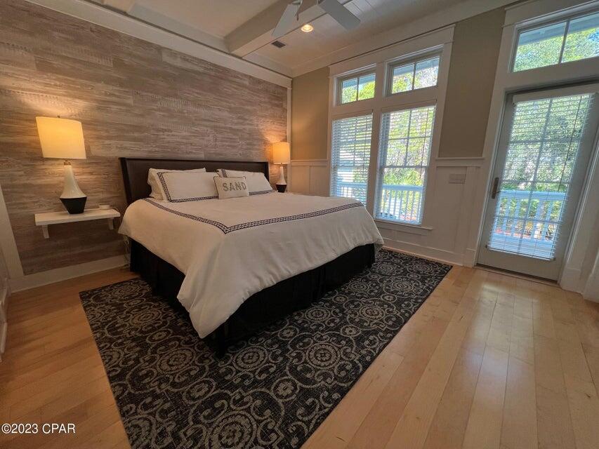 114 Parkshore Drive Panama City Beach, FL 32413 - Photo 29 of 86 a bedroom with a large bed and a large window