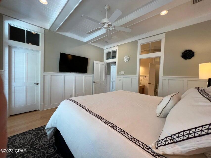 114 Parkshore Drive Panama City Beach, FL 32413 - Photo 31 of 86 a bedroom with a bed and a flat screen tv