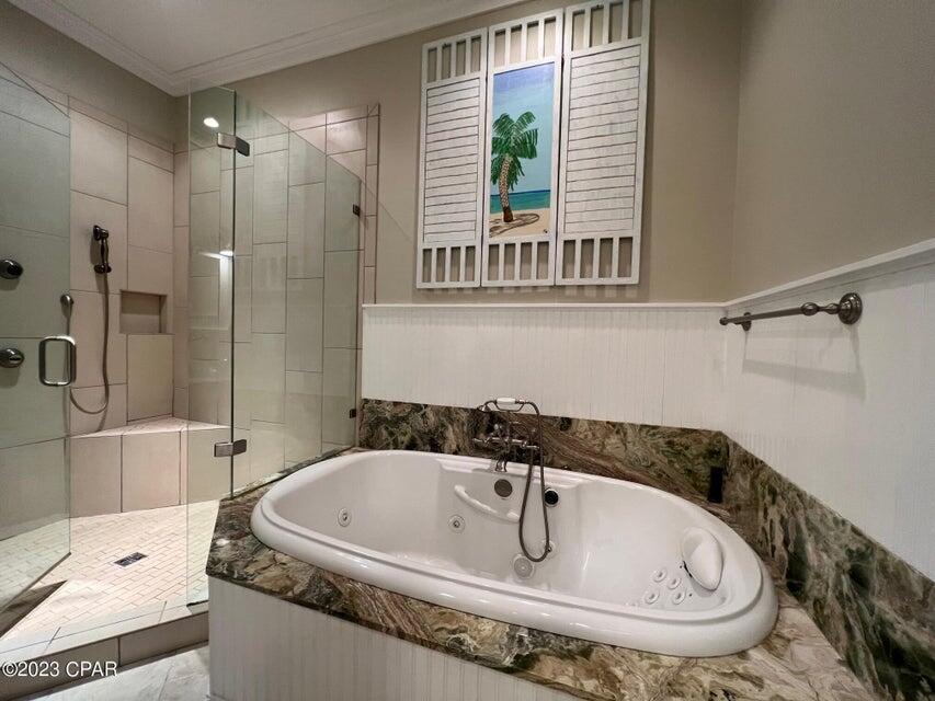 114 Parkshore Drive Panama City Beach, FL 32413 - Photo 34 of 86 a bathroom with a tub and a shower