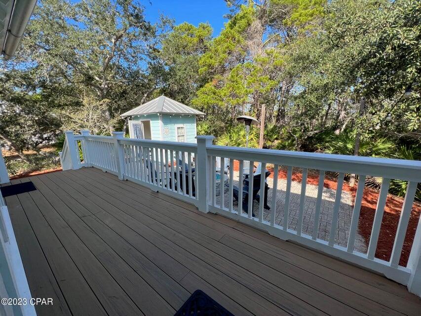 114 Parkshore Drive Panama City Beach, FL 32413 - Photo 38 of 86 a roof deck with wooden floor and fence