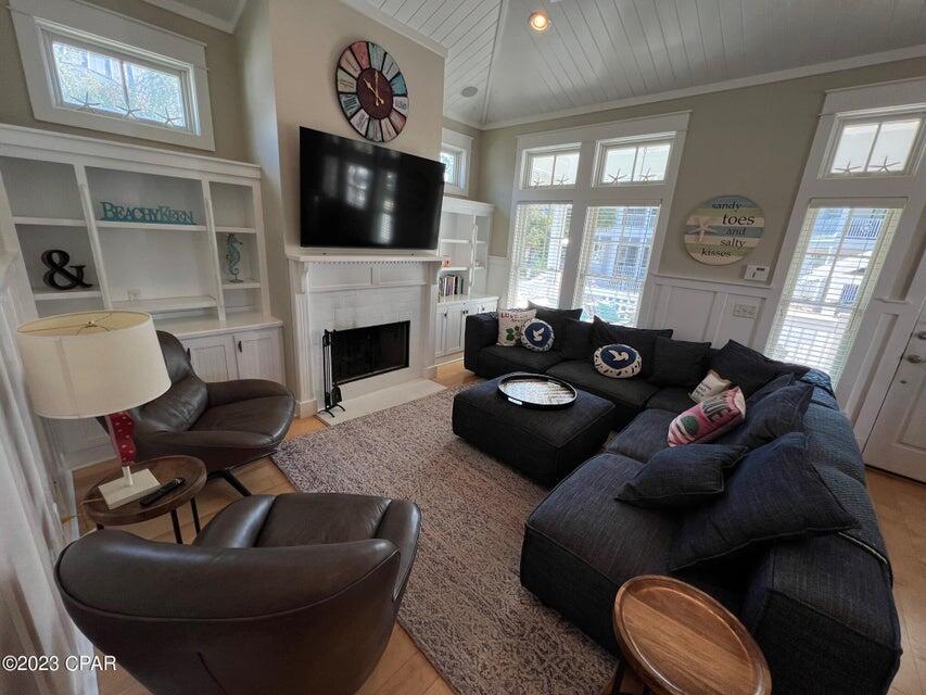 114 Parkshore Drive Panama City Beach, FL 32413 - Photo 4 of 86 a living room with furniture fireplace and a flat screen tv