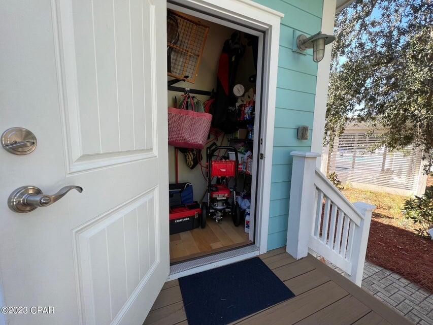 114 Parkshore Drive Panama City Beach, FL 32413 - Photo 41 of 86 a view of a hallway and a livingroom with wooden floor and a bathroom