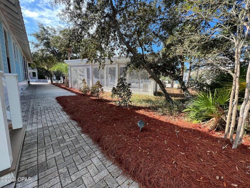 114 Parkshore Drive Panama City Beach, FL 32413 - Photo 49 of 86 a view of a yard with plants and trees