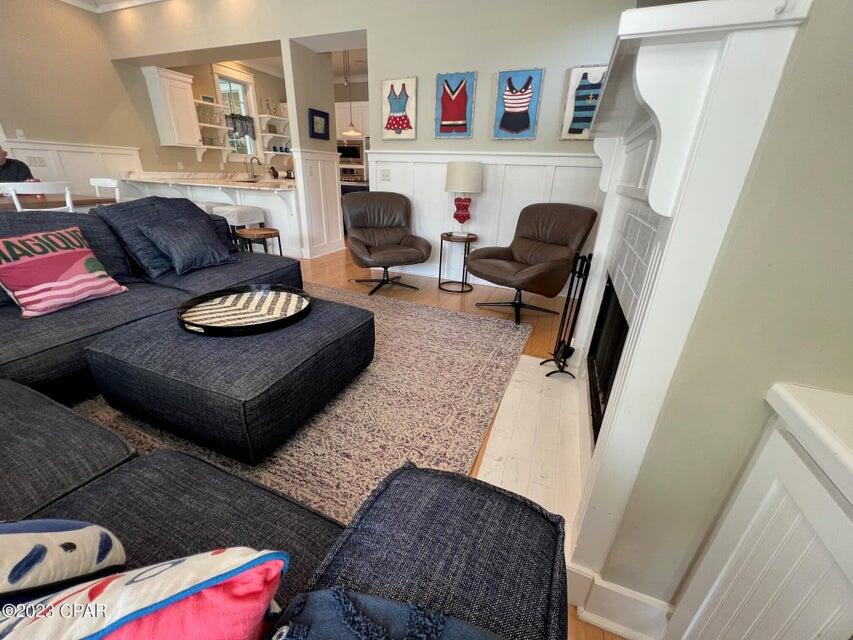 114 Parkshore Drive Panama City Beach, FL 32413 - Photo 5 of 86 a living room with furniture and a wooden floor