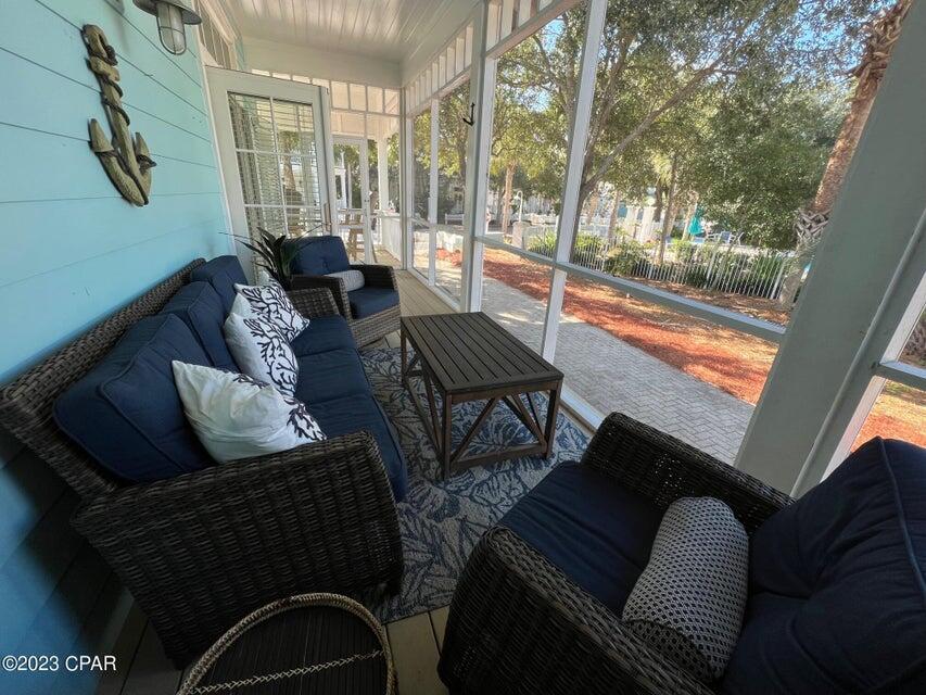 114 Parkshore Drive Panama City Beach, FL 32413 - Photo 67 of 86 a living room with furniture and a floor to ceiling window
