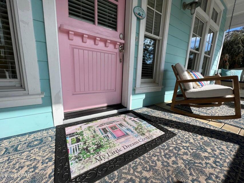 114 Parkshore Drive Panama City Beach, FL 32413 - Photo 70 of 86 a front view of a house with a wooden bench
