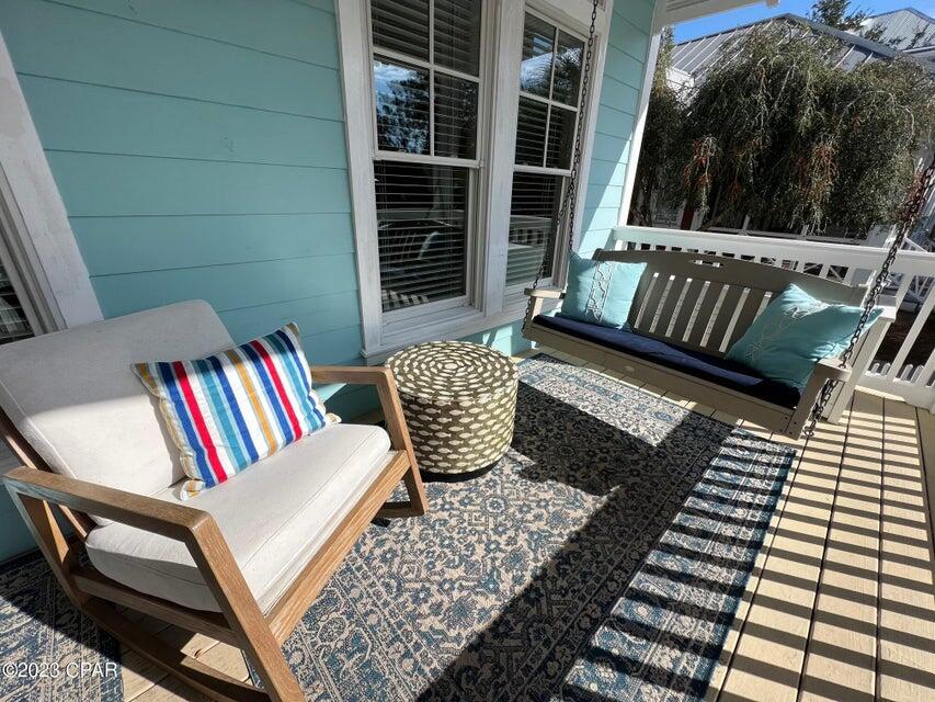 114 Parkshore Drive Panama City Beach, FL 32413 - Photo 71 of 86 a view of balcony with two chairs and a book shelf