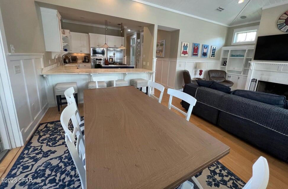 114 Parkshore Drive Panama City Beach, FL 32413 - Photo 77 of 86 a living room with furniture and a flat screen tv