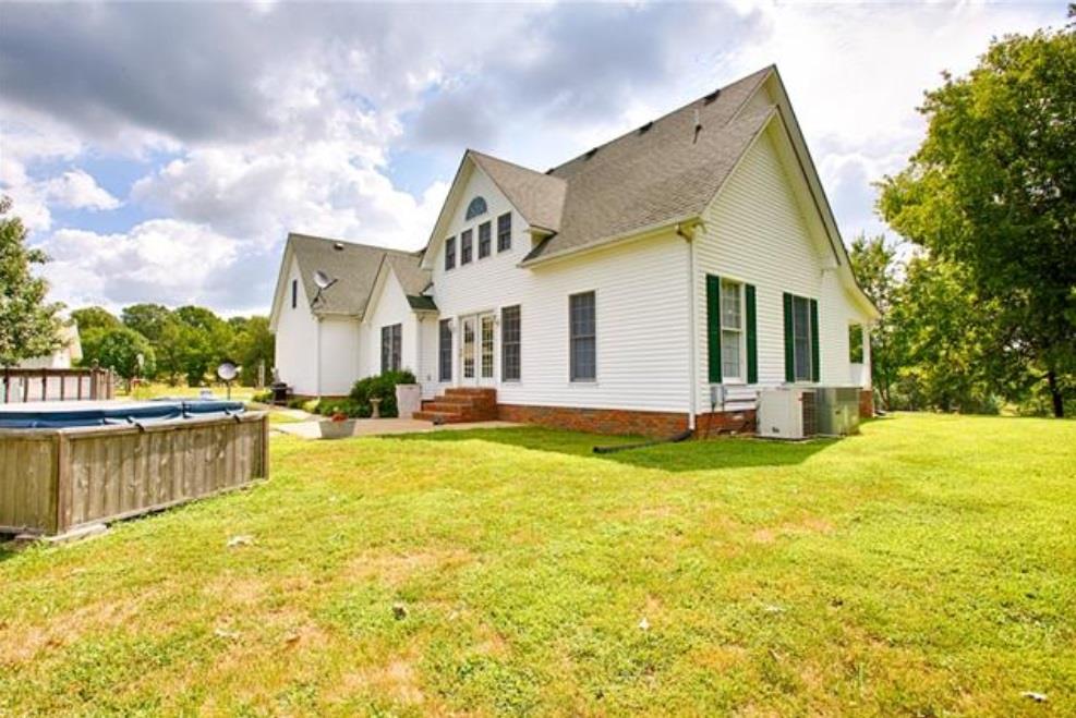 1000 Veto Road Prospect, TN 38477 - Photo 2 of 30 a view of a white house with a swimming pool and a yard