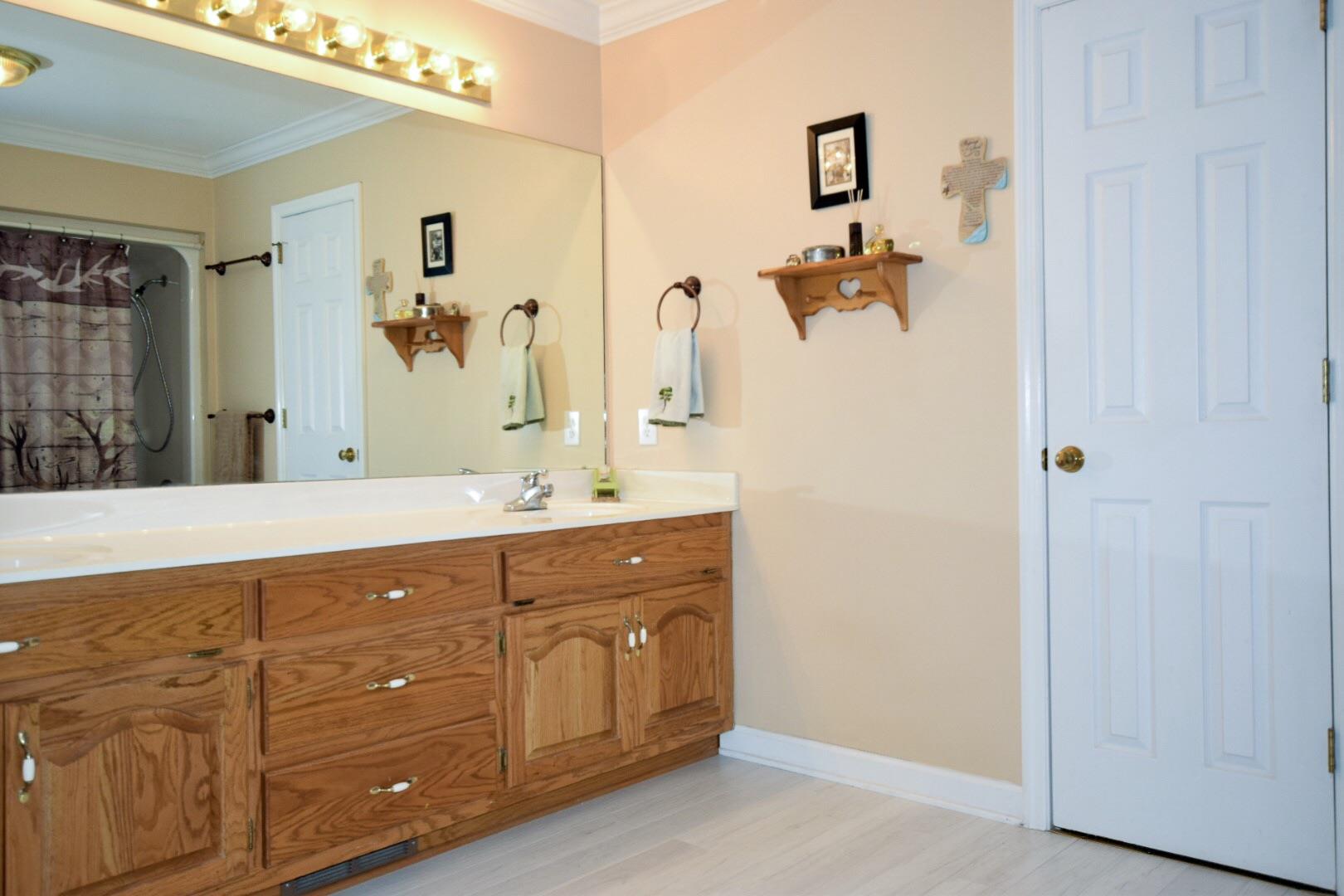1000 Veto Road Prospect, TN 38477 - Photo 24 of 30 a spacious bathroom with a double vanity sink a mirror and shower