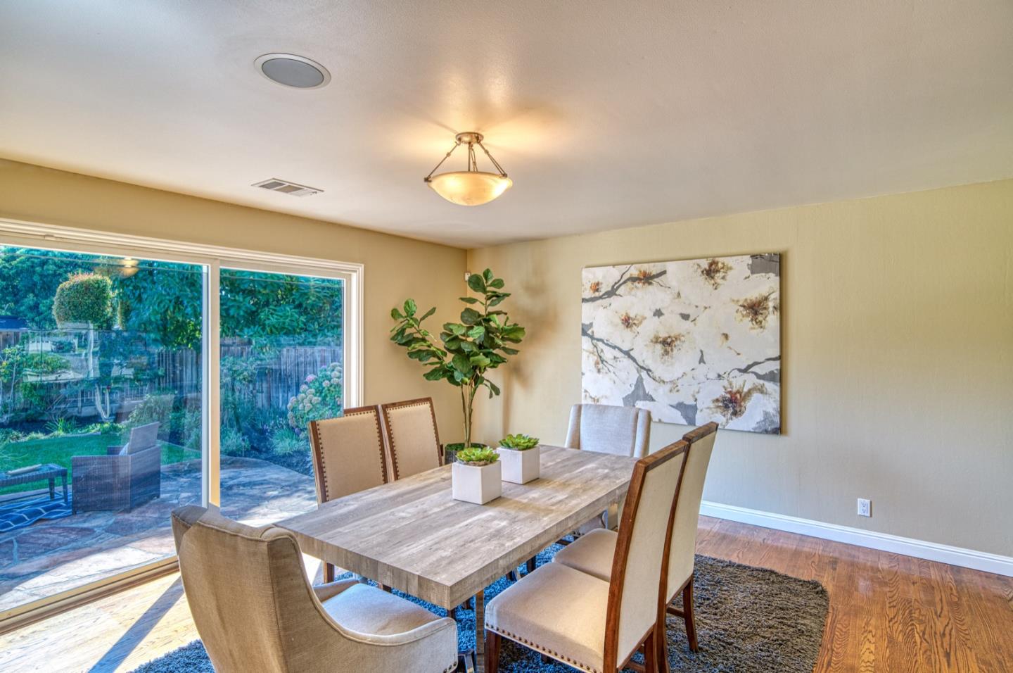 1174 Crandano Court Sunnyvale, CA 94087 - Photo 13 of 49 a dining room with furniture and wooden floor