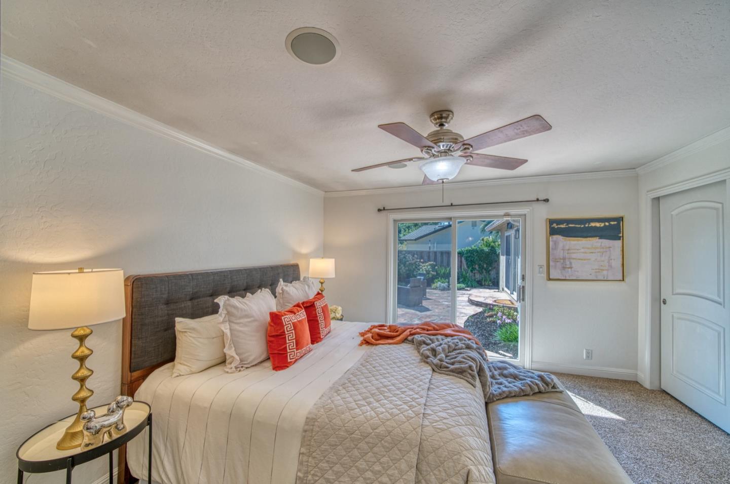 1174 Crandano Court Sunnyvale, CA 94087 - Photo 28 of 49 a bedroom with a large bed and a large window