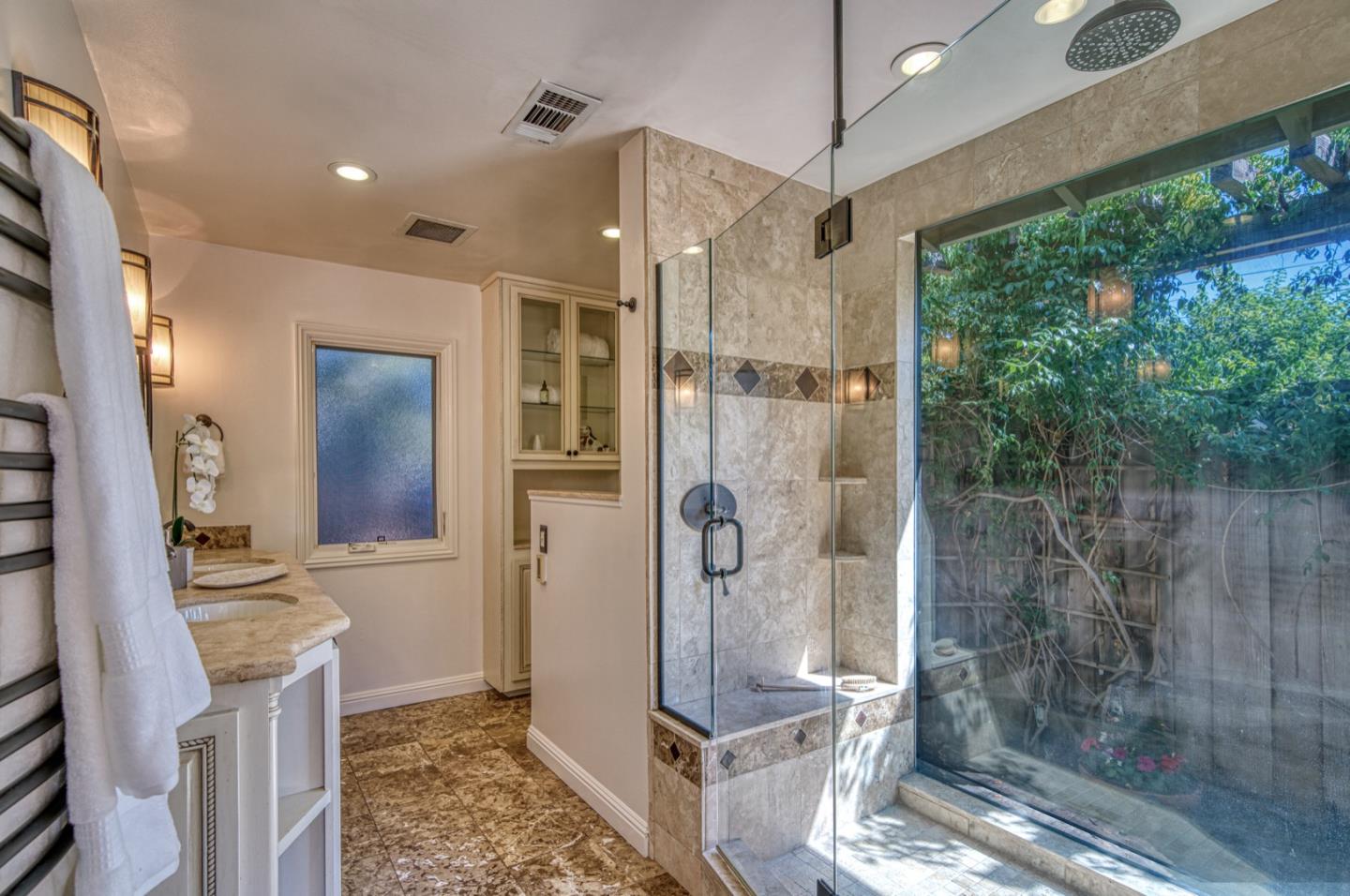 1174 Crandano Court Sunnyvale, CA 94087 - Photo 30 of 49 a bathroom with a glass shower door and a sink