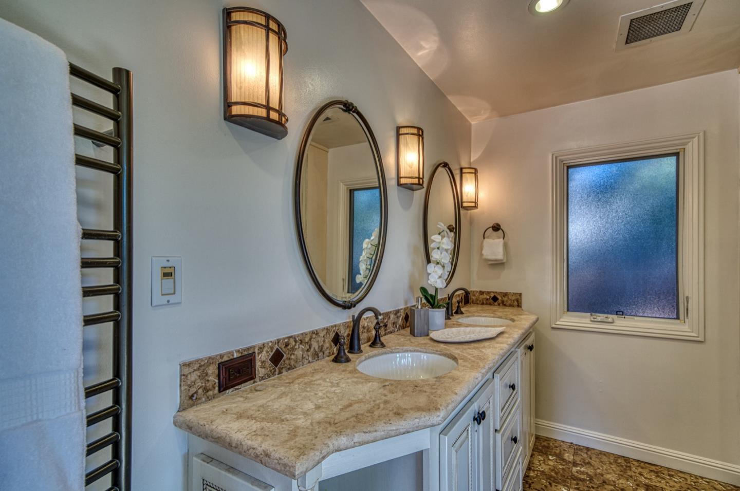 1174 Crandano Court Sunnyvale, CA 94087 - Photo 31 of 49 a bathroom with a granite countertop sink and a mirror