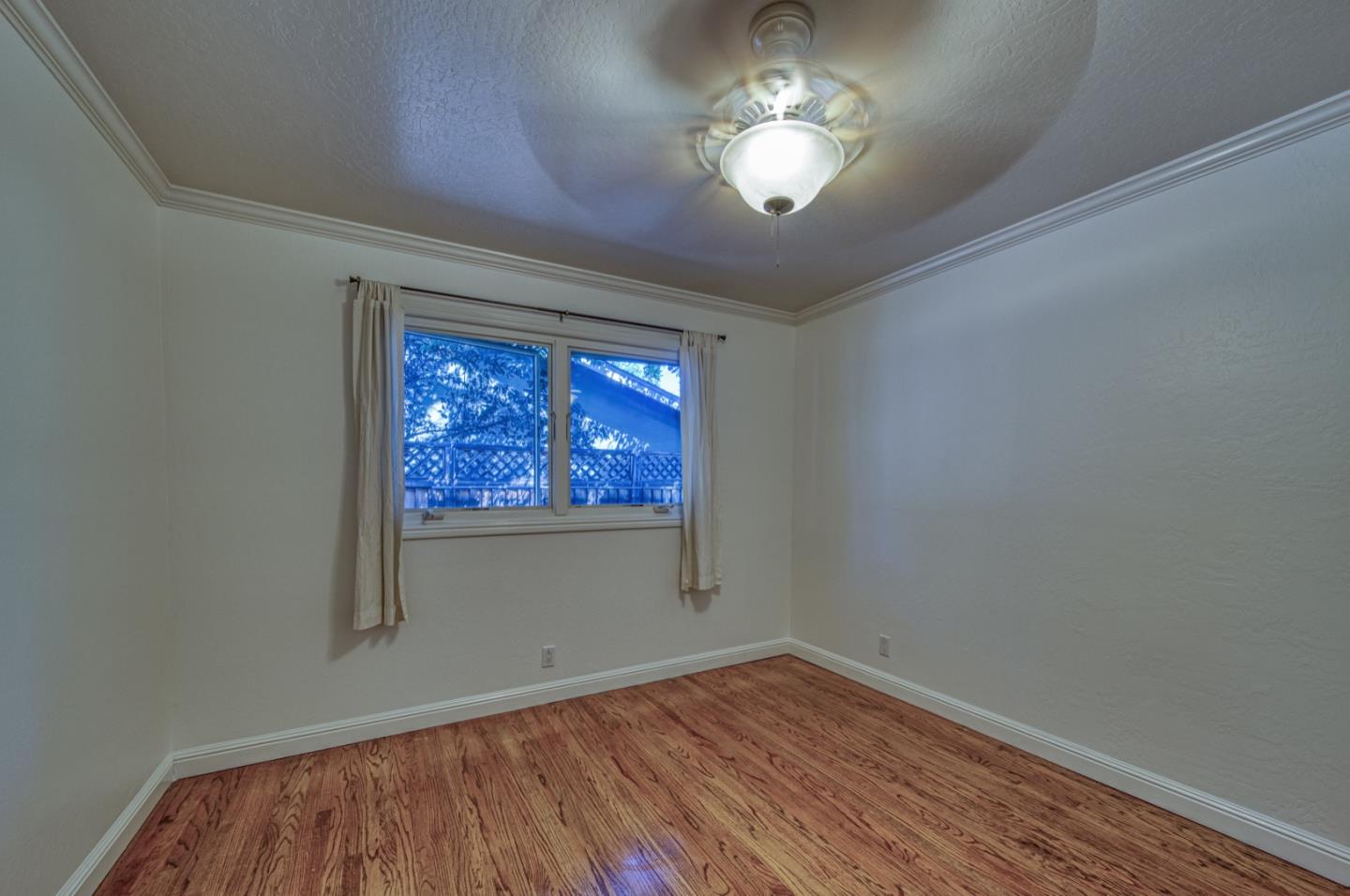 1174 Crandano Court Sunnyvale, CA 94087 - Photo 32 of 49 wooden floor in an empty room with a window