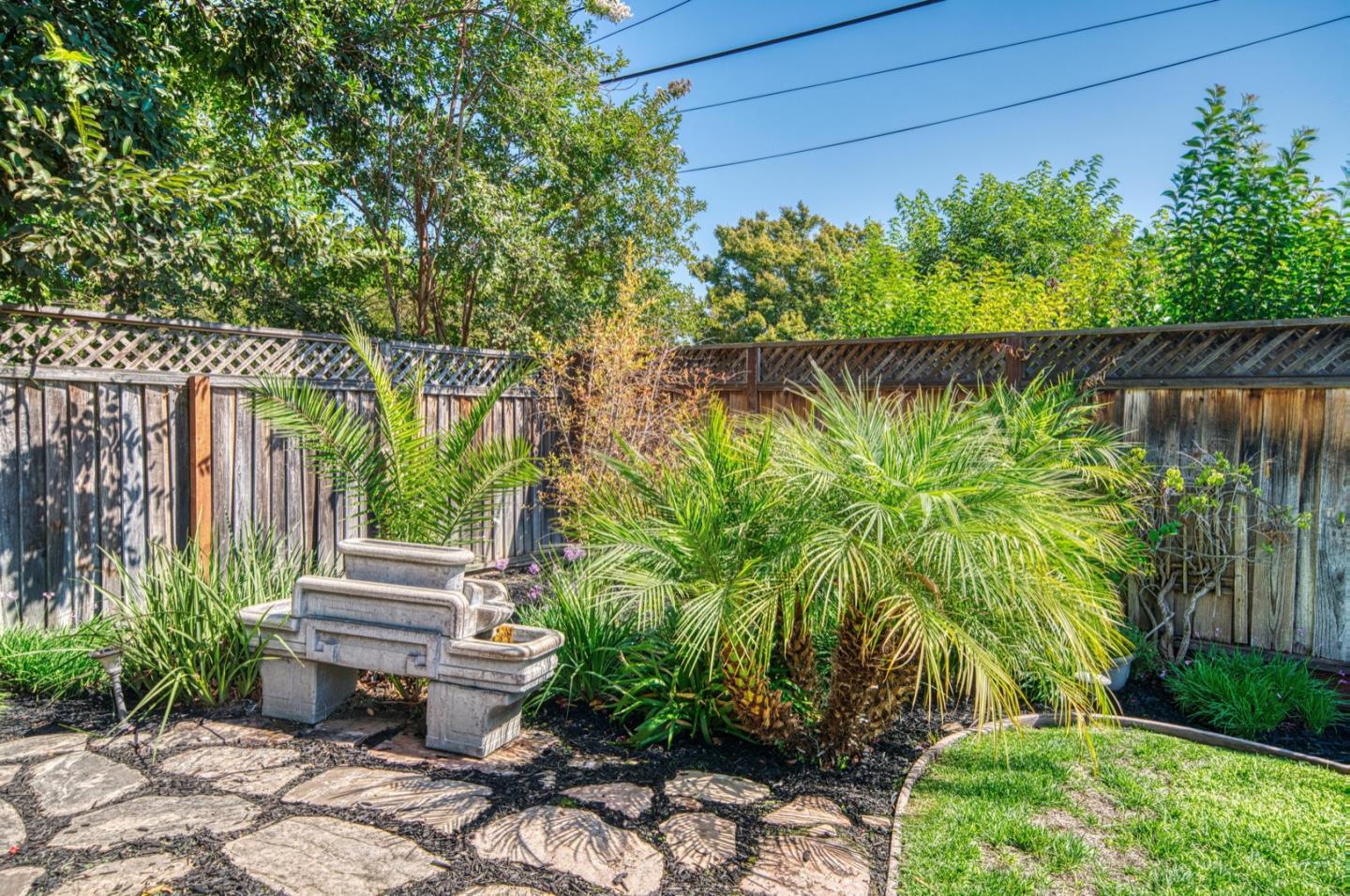 1174 Crandano Court Sunnyvale, CA 94087 - Photo 41 of 49 a backyard of a house with lots of green space and outdoor seating