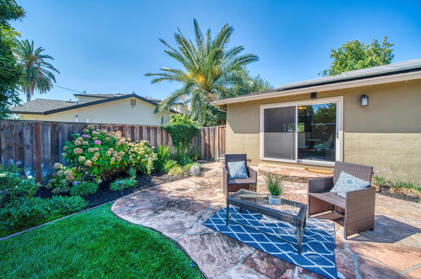 1174 Crandano Court Sunnyvale, CA 94087 - Photo 44 of 49 a view of a house with backyard sitting area and garden