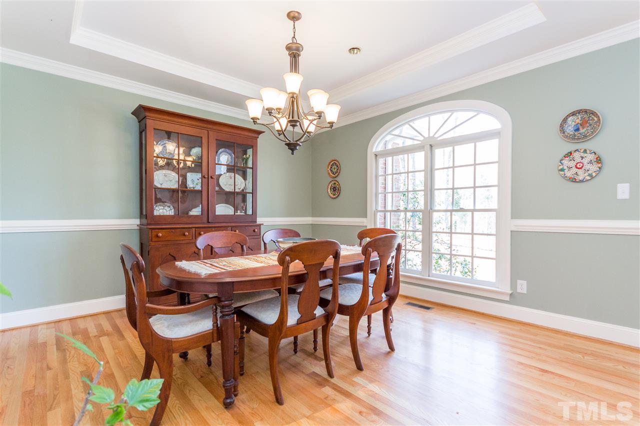10616 Cahill Road Raleigh, NC 27614 - Photo 2 of 24 a view of a dining room with furniture window and wooden floor