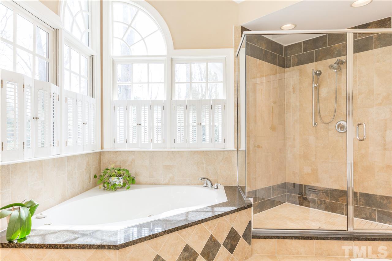 10616 Cahill Road Raleigh, NC 27614 - Photo 11 of 24 a bathroom with a tub and a window