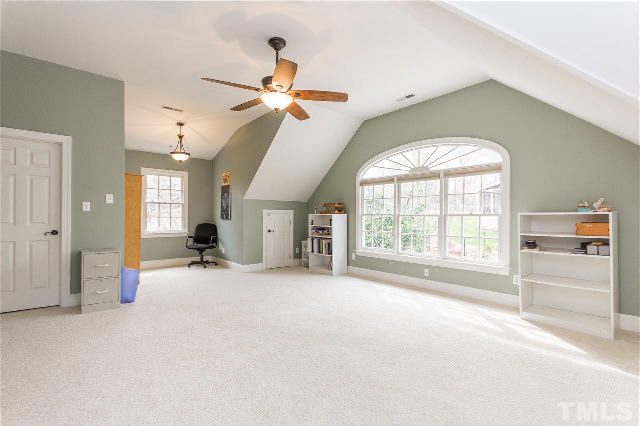 10616 Cahill Road Raleigh, NC 27614 - Photo 13 of 24 an empty room with windows and ceiling fan