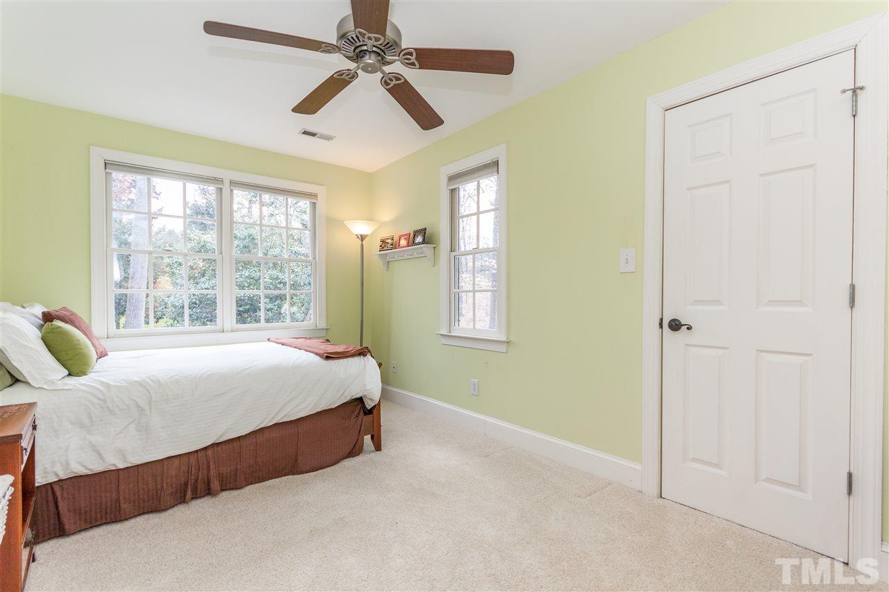10616 Cahill Road Raleigh, NC 27614 - Photo 14 of 24 a bedroom with a bed and a window