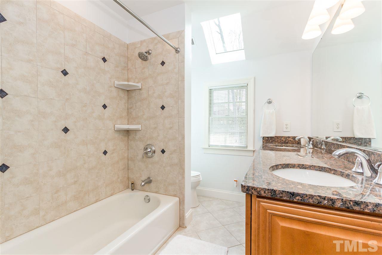 10616 Cahill Road Raleigh, NC 27614 - Photo 17 of 24 a bathroom with a granite countertop tub sink and mirror