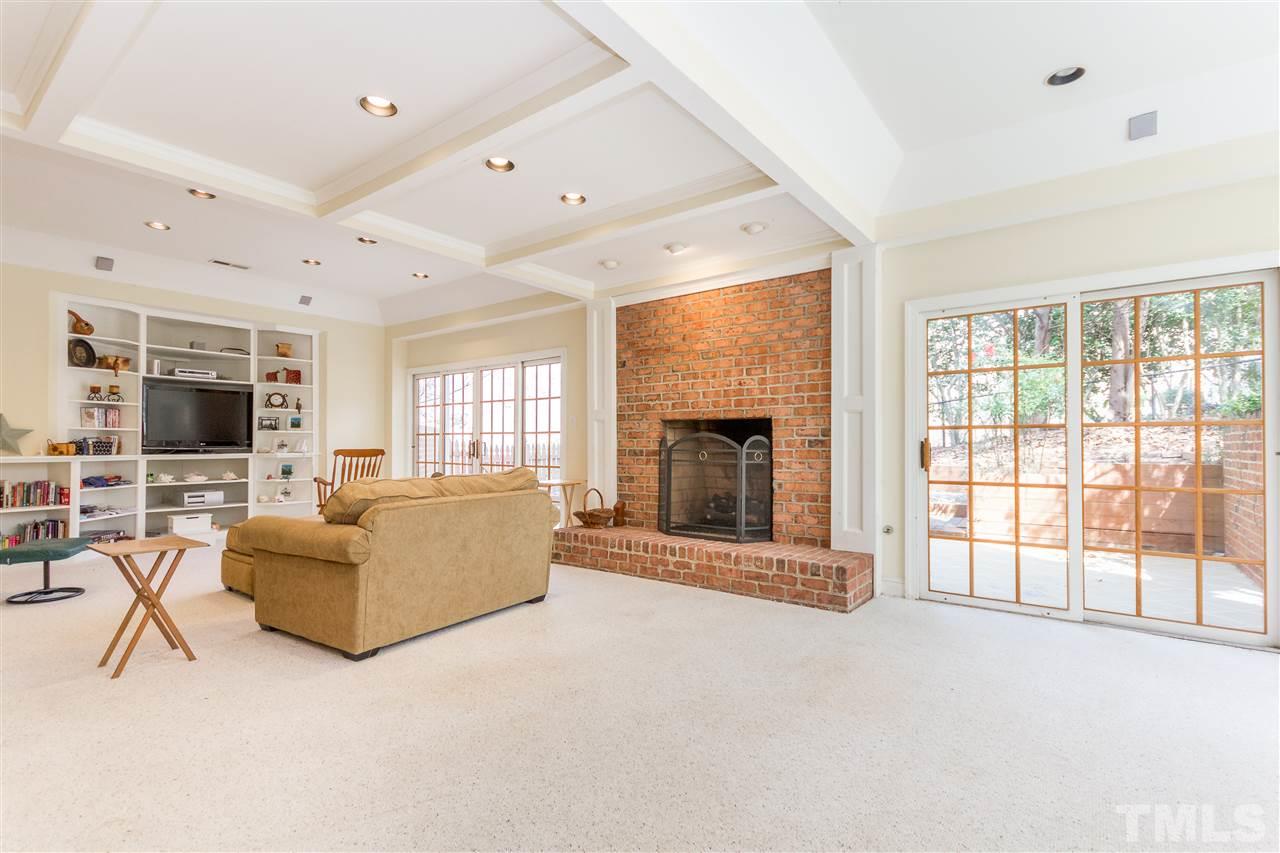 10616 Cahill Road Raleigh, NC 27614 - Photo 19 of 24 a living room with furniture a flat screen tv and a fireplace