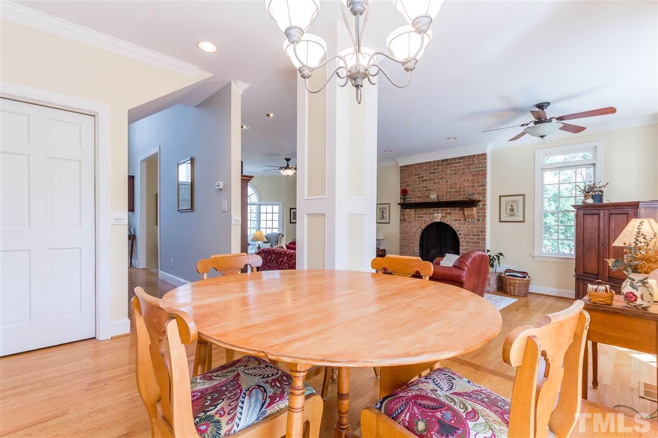 10616 Cahill Road Raleigh, NC 27614 - Photo 5 of 24 a view of a dining room with furniture and wooden floor