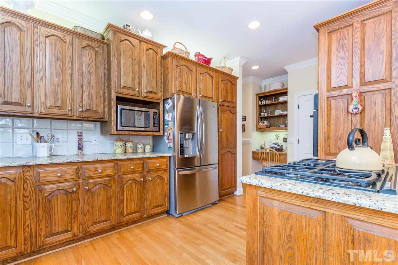 10616 Cahill Road Raleigh, NC 27614 - Photo 7 of 24 a kitchen with stainless steel appliances granite countertop a refrigerator and a sink